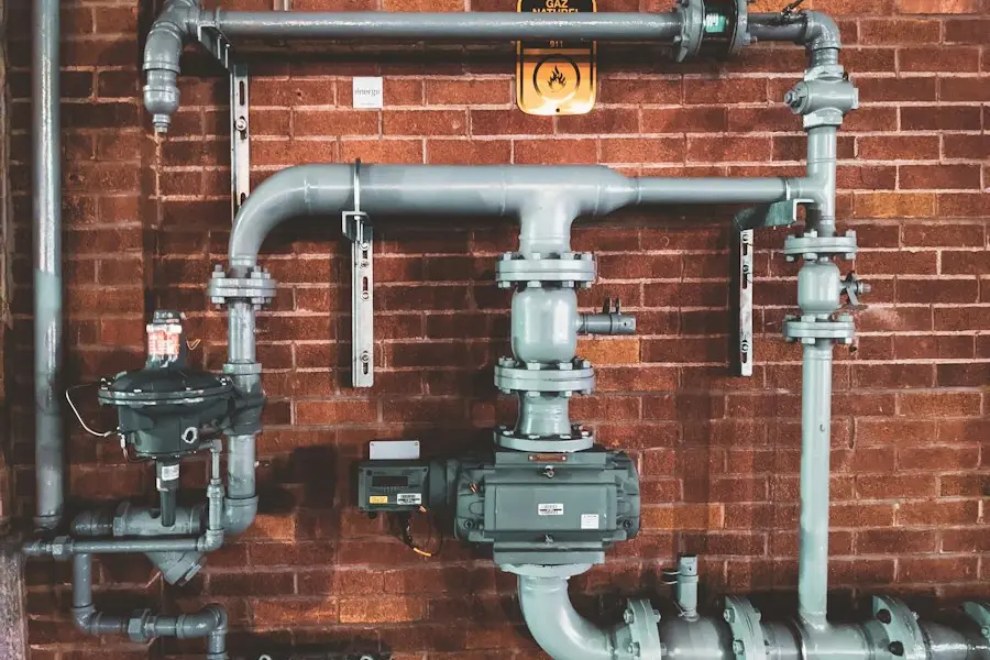 Large drain and vent pipes on a brick wall