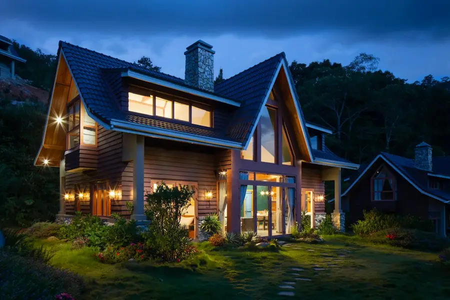 A house at dusk with the lights on